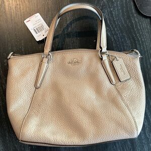 Coach mini Kelsey leather handbag with shoulder strap. New with tags. Light gold